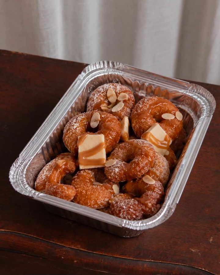 Fresh doughnuts topped with almonds